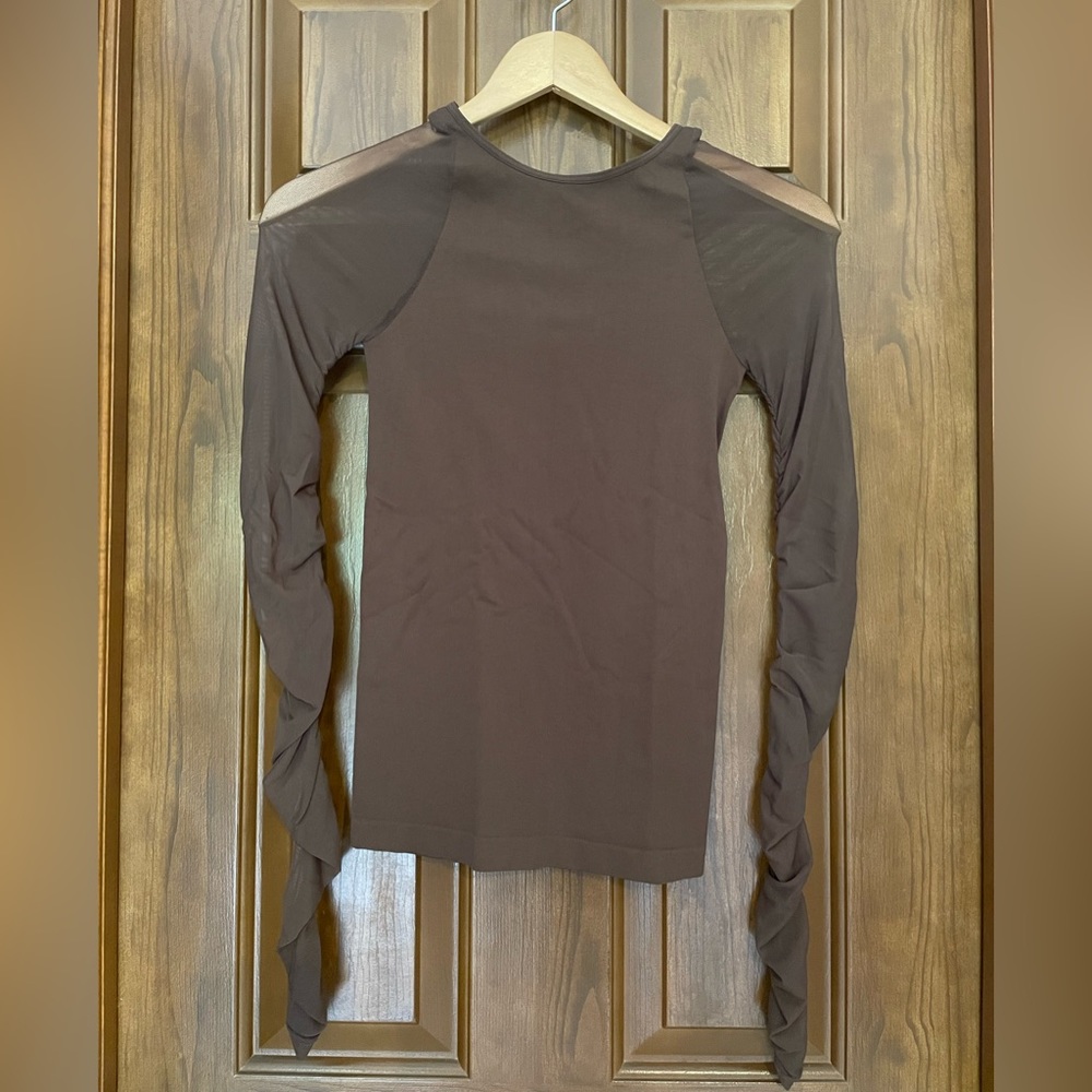 Free People intimately long sleeved top with sheer mesh sleeves